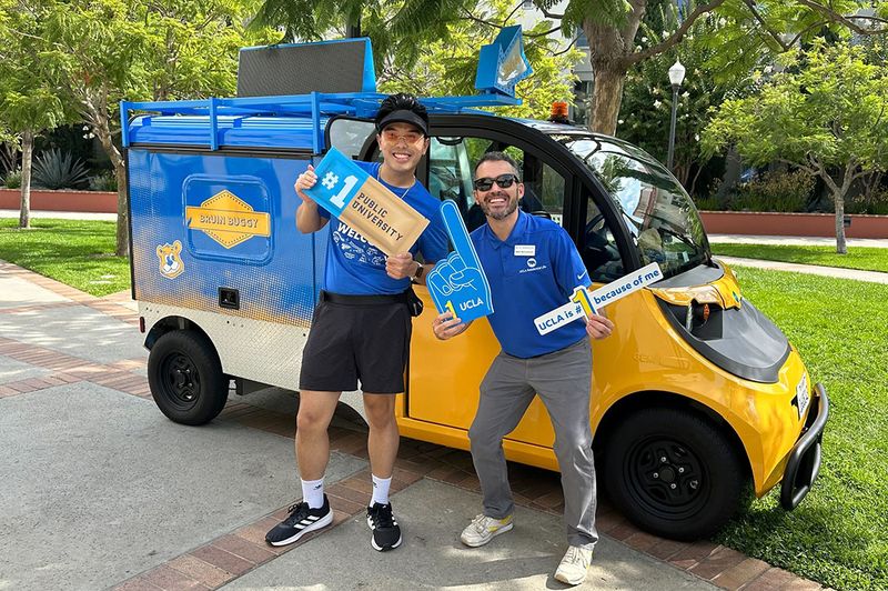 Mike McCormack with the Bruin Buggy car helping students connect to campus resources